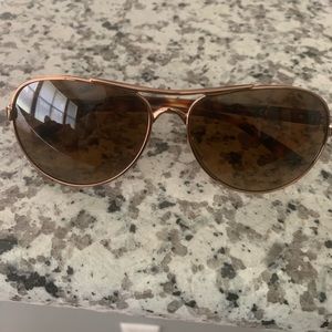 Rose gold Oakley Sun glasses
